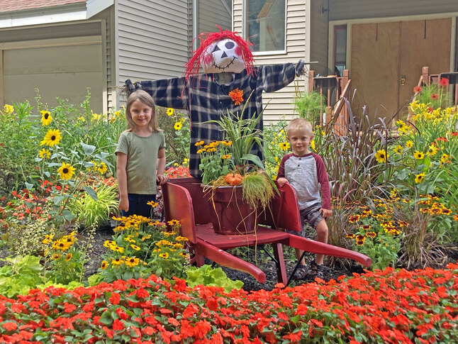 Colorful fall scarecrow, a fun addition to the Scarecrow-in-a-Pot activity at Bemis Farms Nursery.